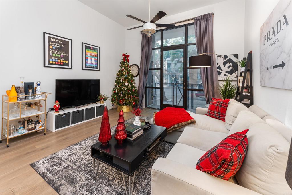 a living room with furniture and a flat screen tv