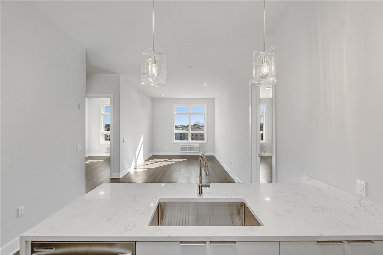 a kitchen with a sink and a refrigerator