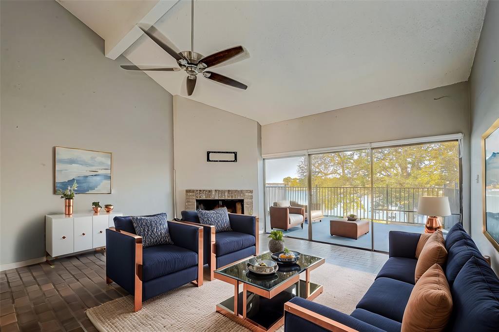 Virtual Staging of the second floor living room, showing the beautiful view of the Lake Conroe.