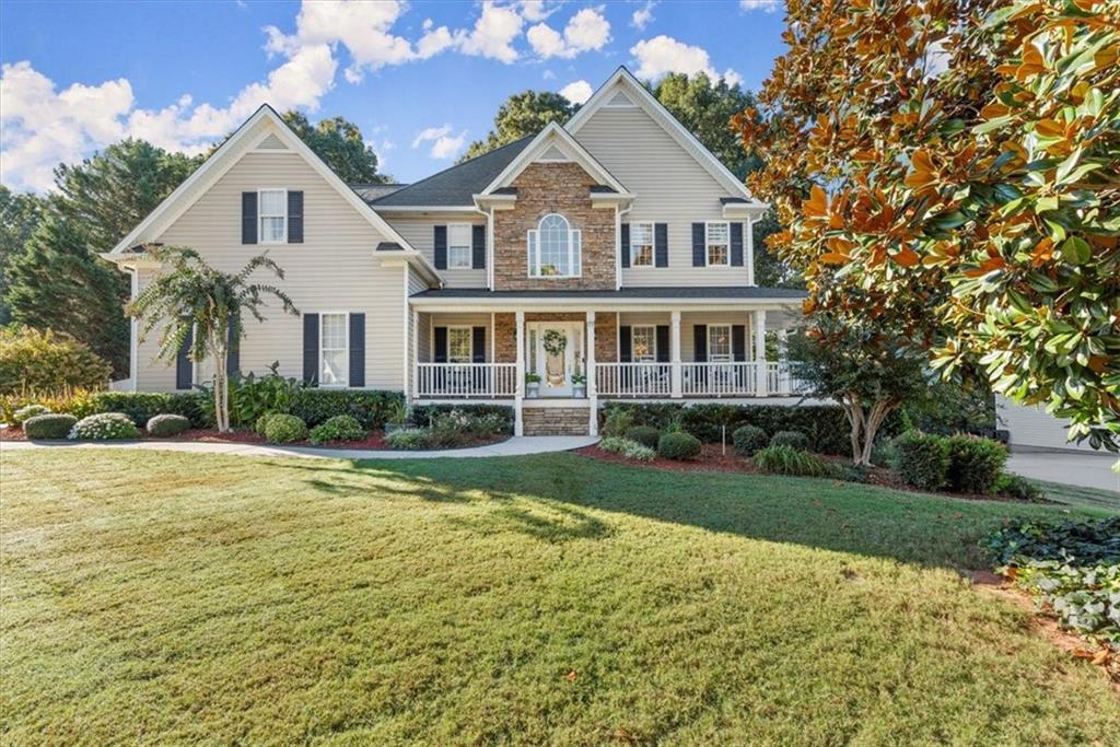 a front view of a house with garden