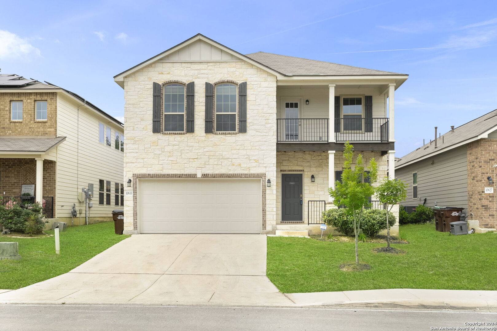 a view of a yard in front view of a house