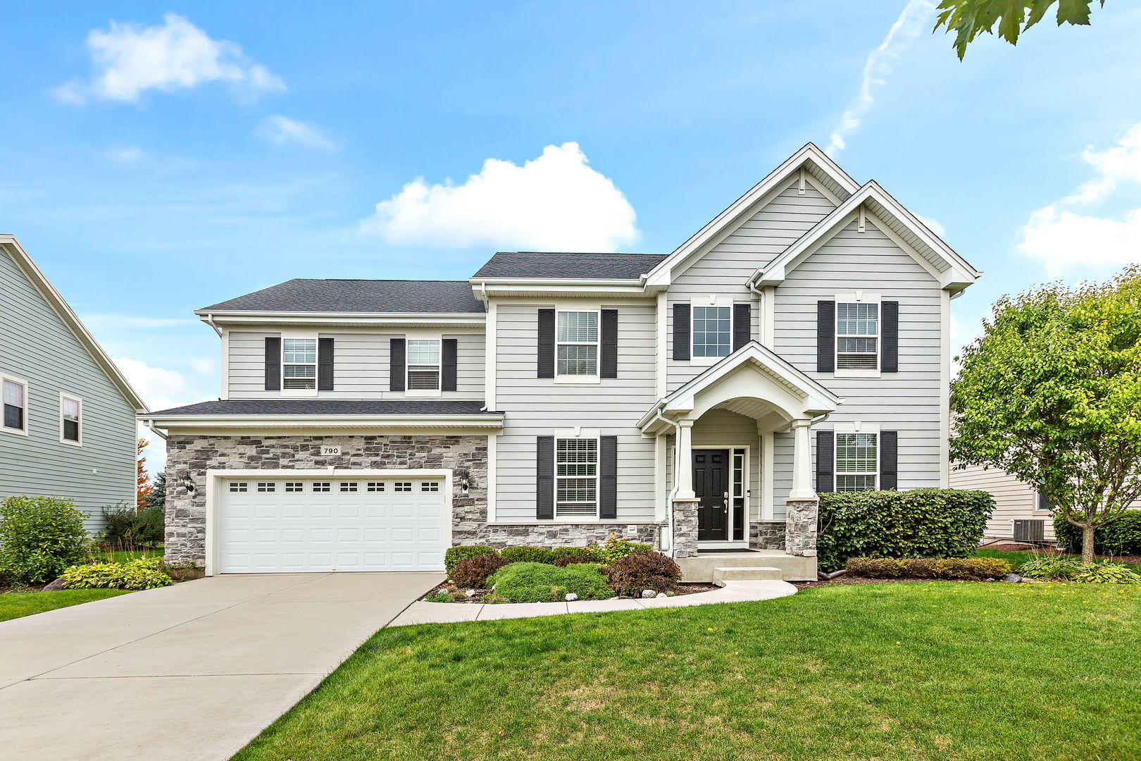 front view of a house with a yard