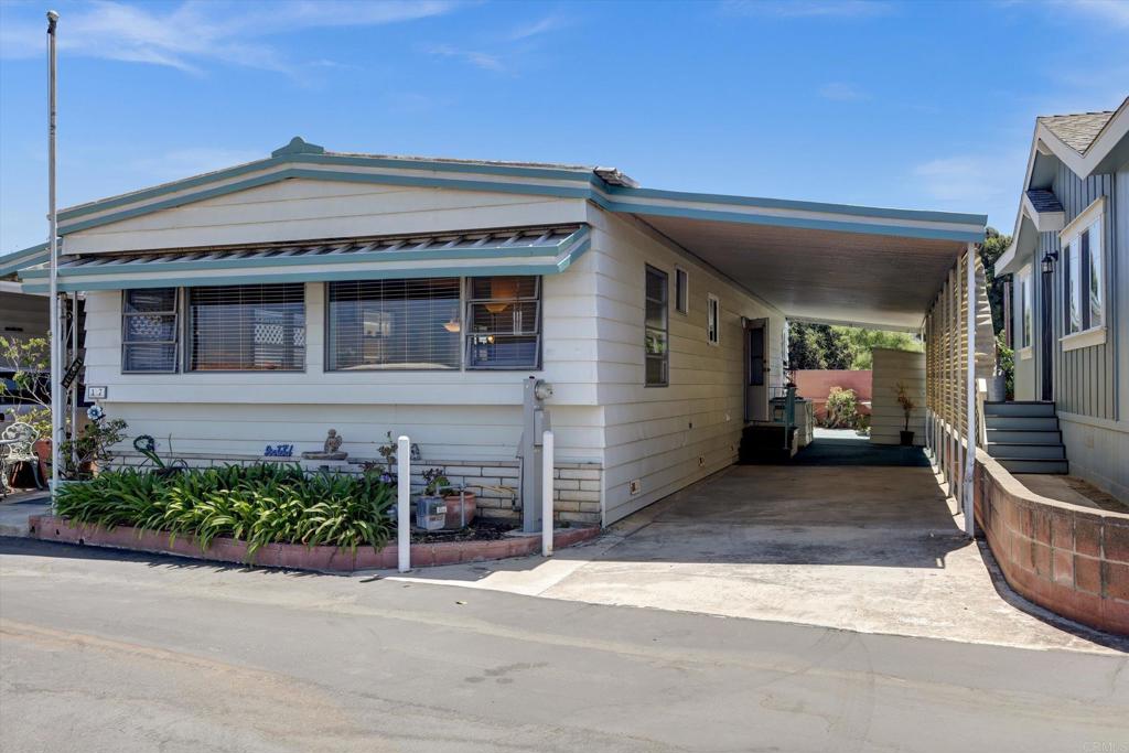 a view of a house with a street