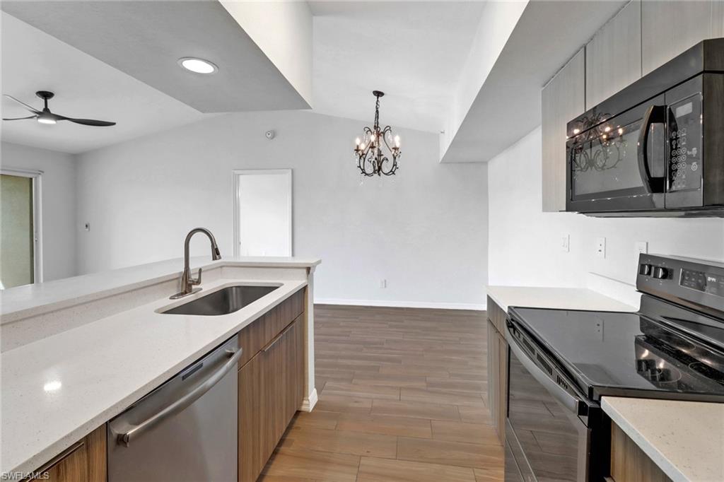 a kitchen with a sink and a stove