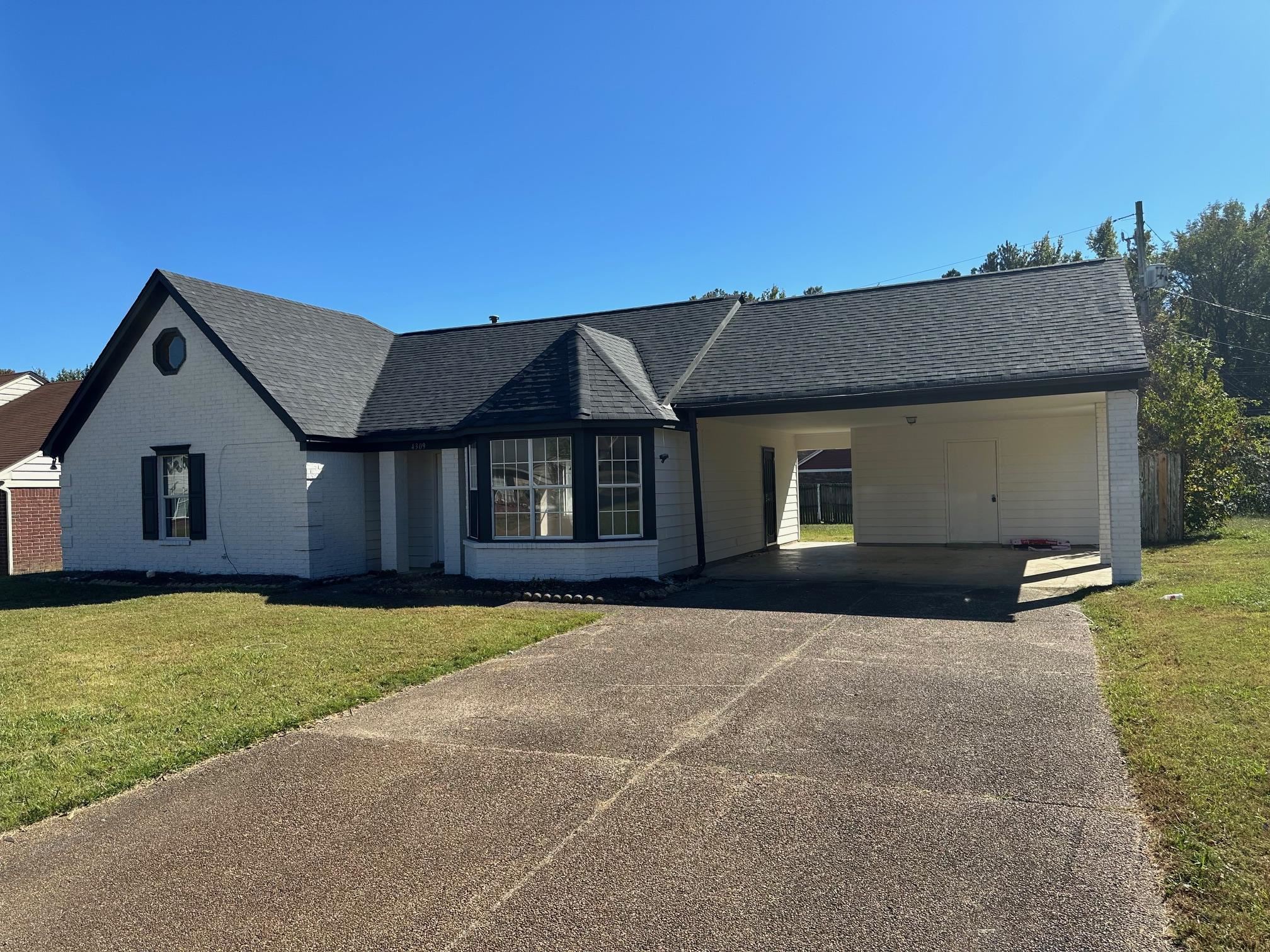 a front view of a house with yard