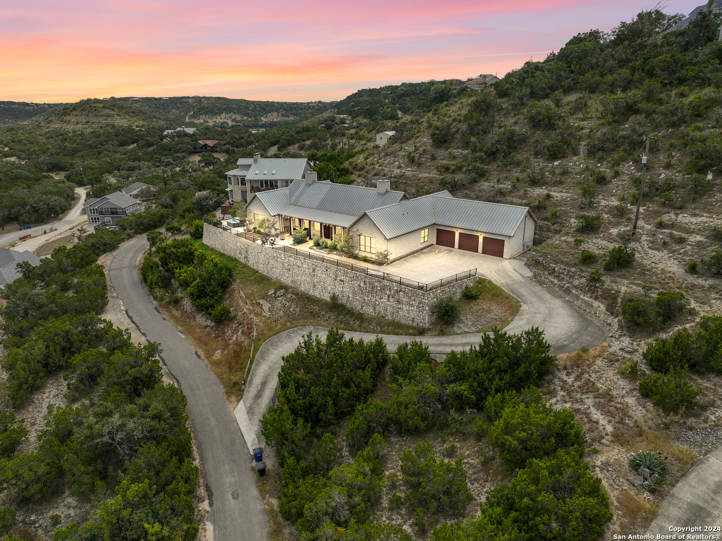 an aerial view of a house with a garden