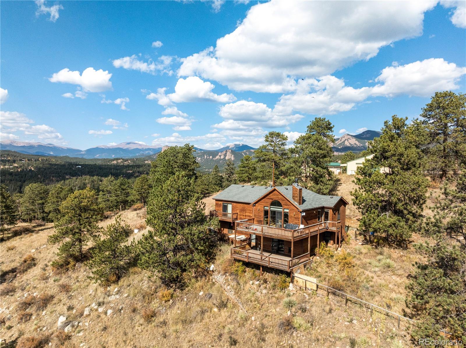 a aerial view of a house with a yard