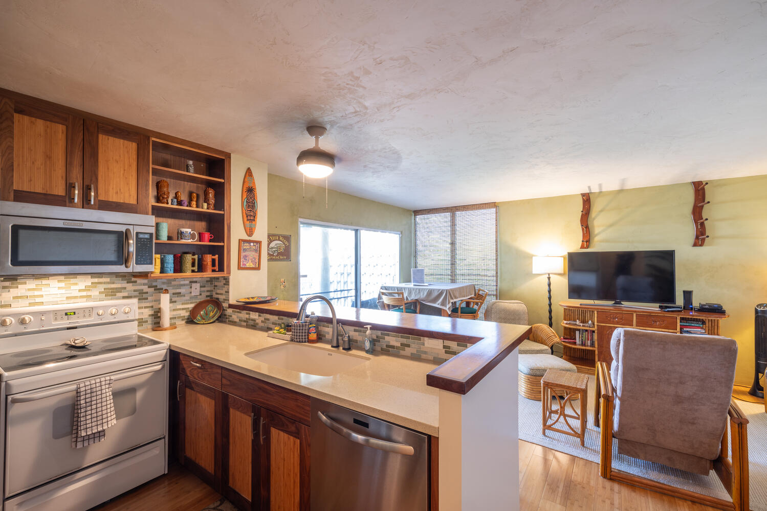 Updated Kitchen - Open Living Room with bar top seating. Surfboard Racks