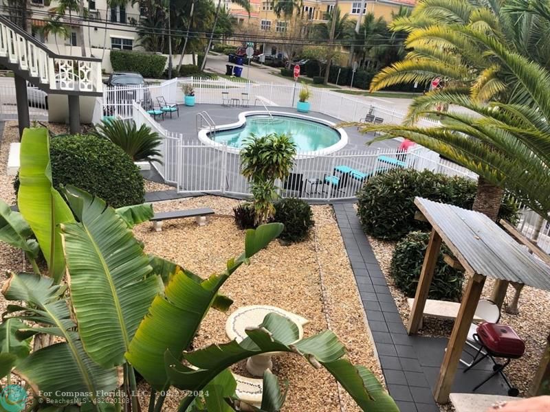 a view of a swimming pool with a patio