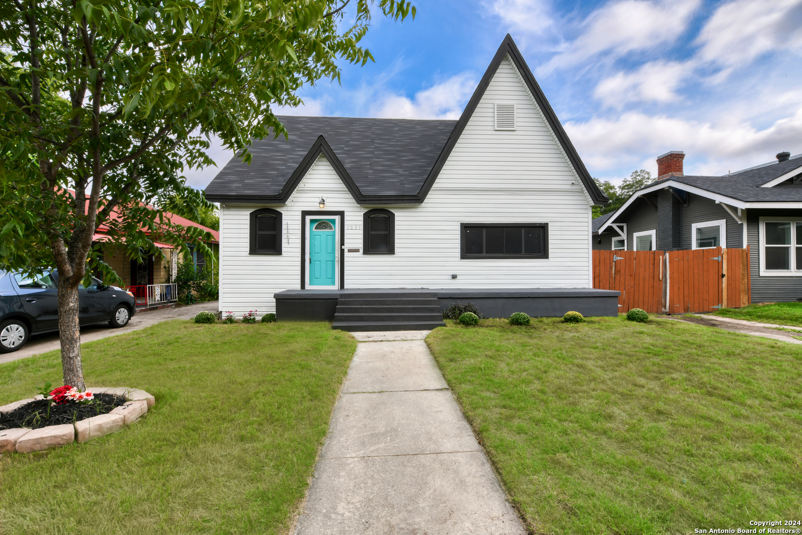 a front view of house with yard and green space