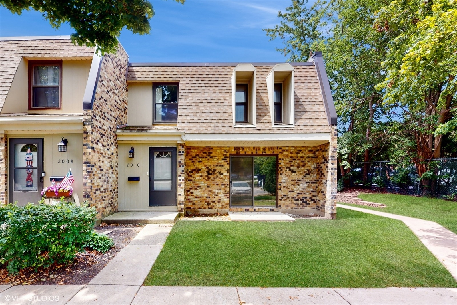 front view of a house with a yard