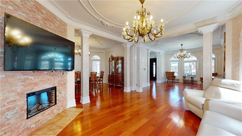 a living room with fireplace furniture and a flat screen tv