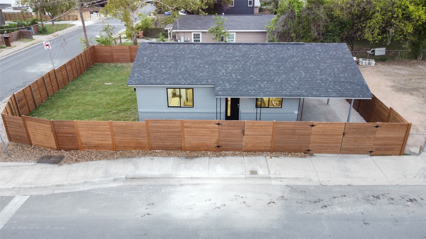 a aerial view of a house with a yard