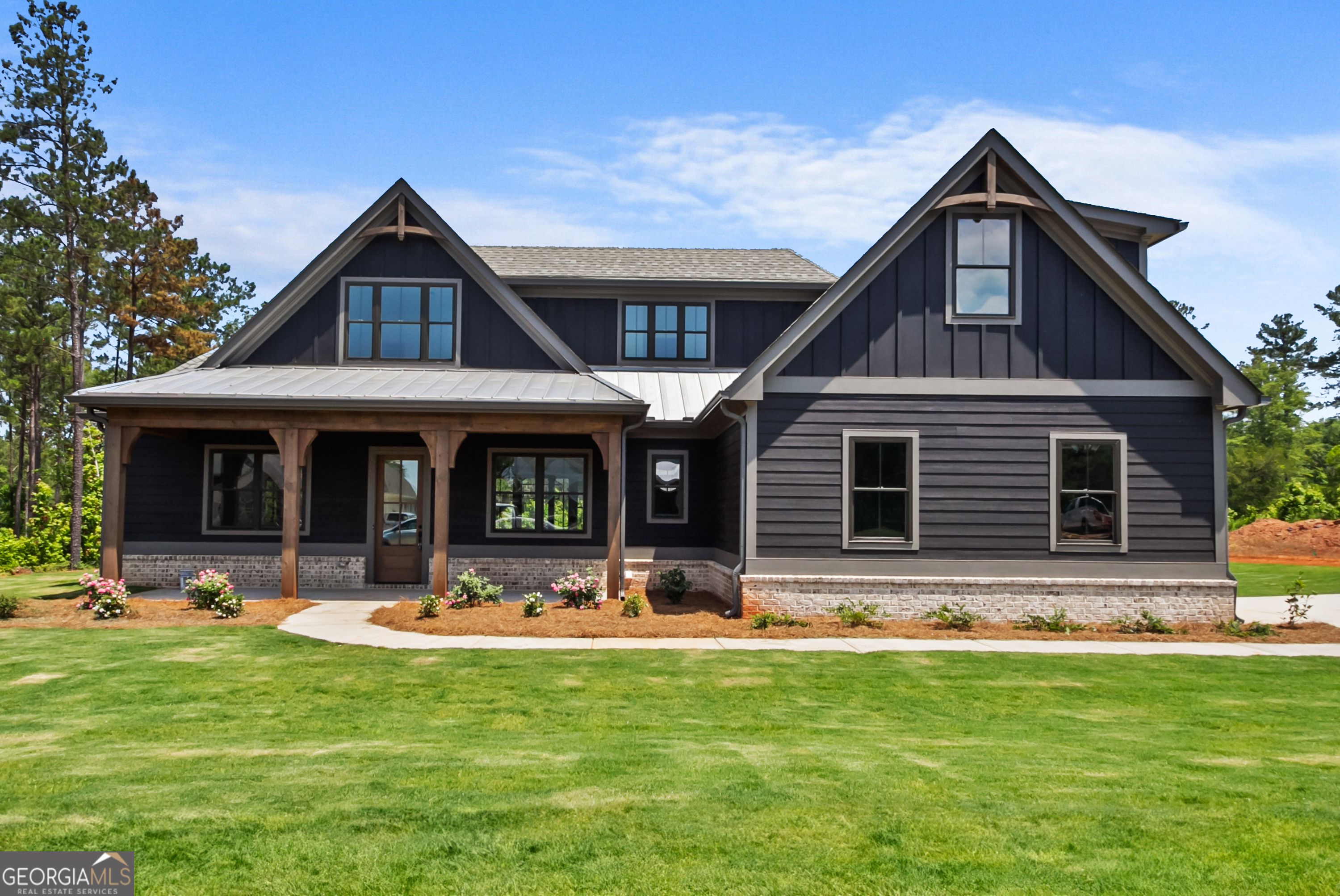 a front view of house with yard outdoor seating and yard