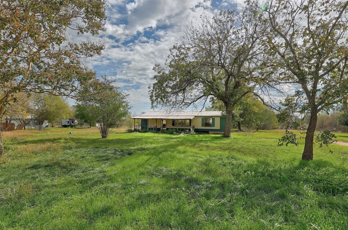 a view of a house with a big yard