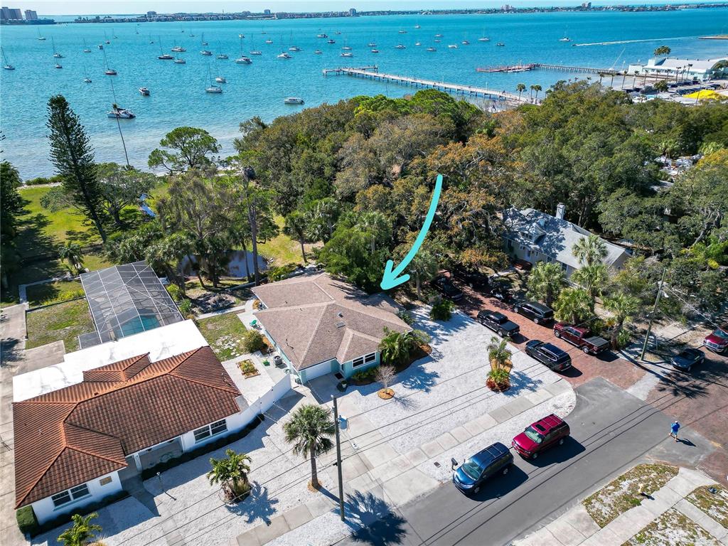 an aerial view of multiple houses with yard