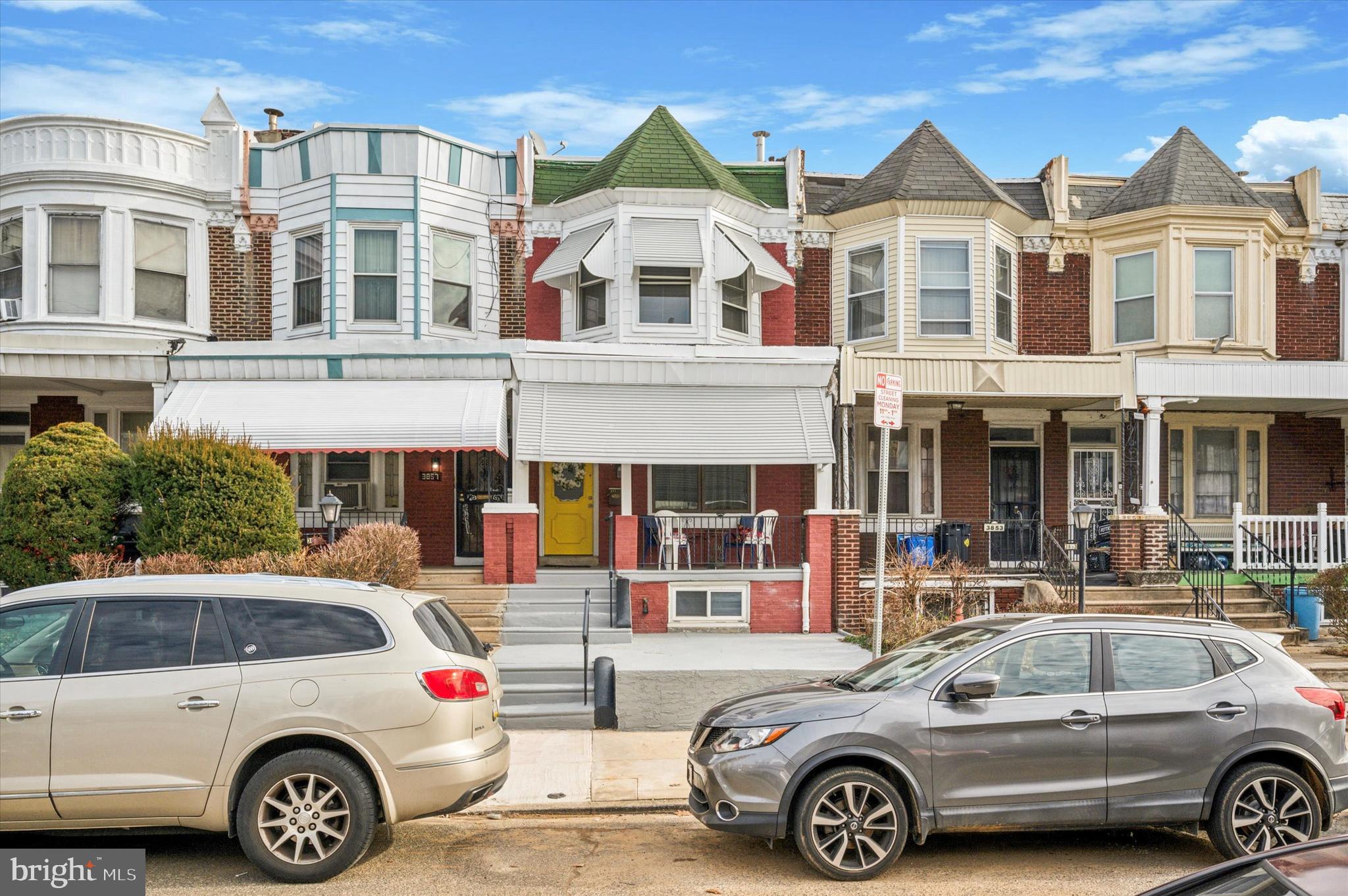 a front view of a house with parking space