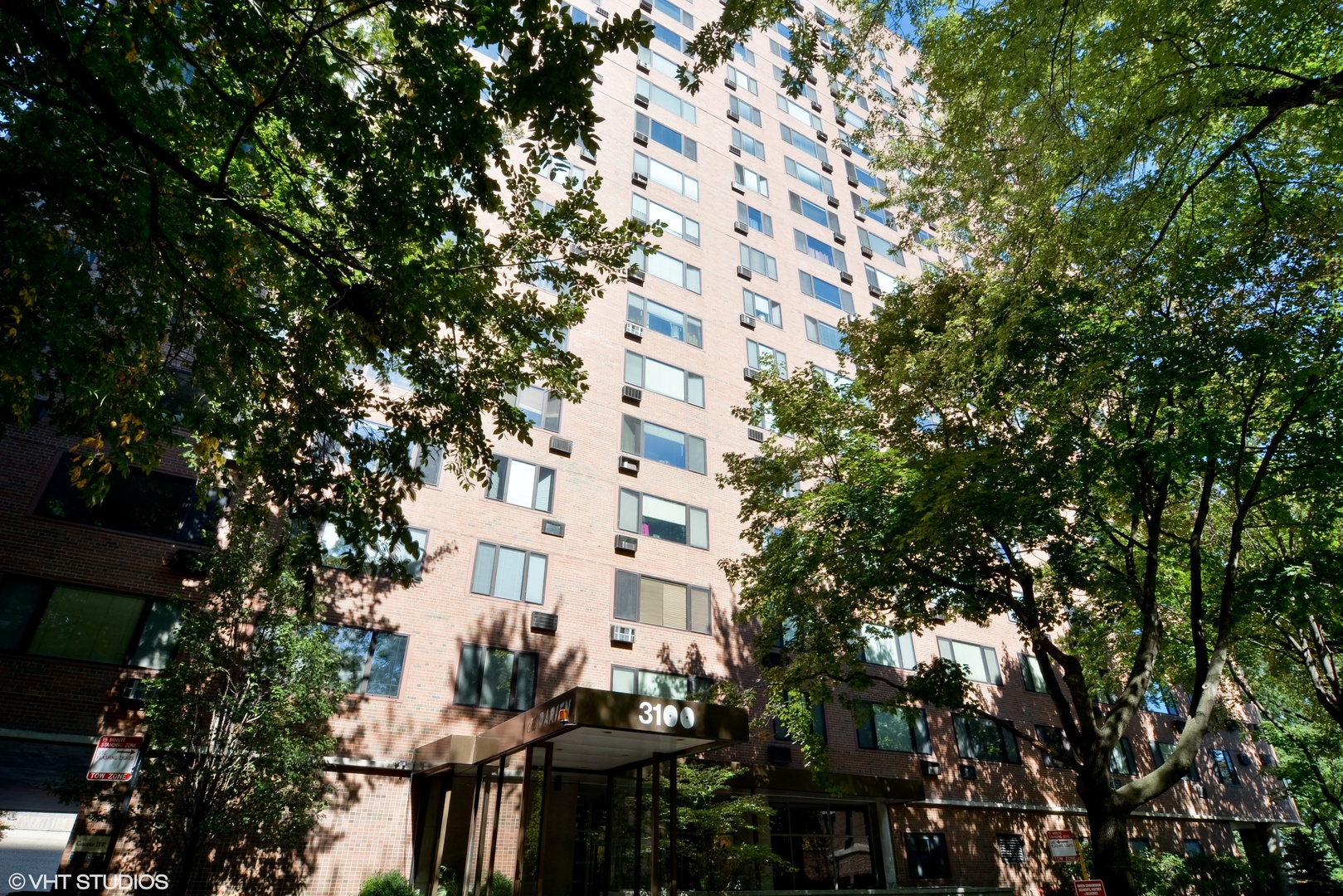 a view of a building with a tree