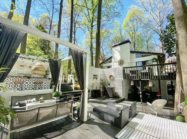 a view of backyard with barbeque grill and outdoor seating