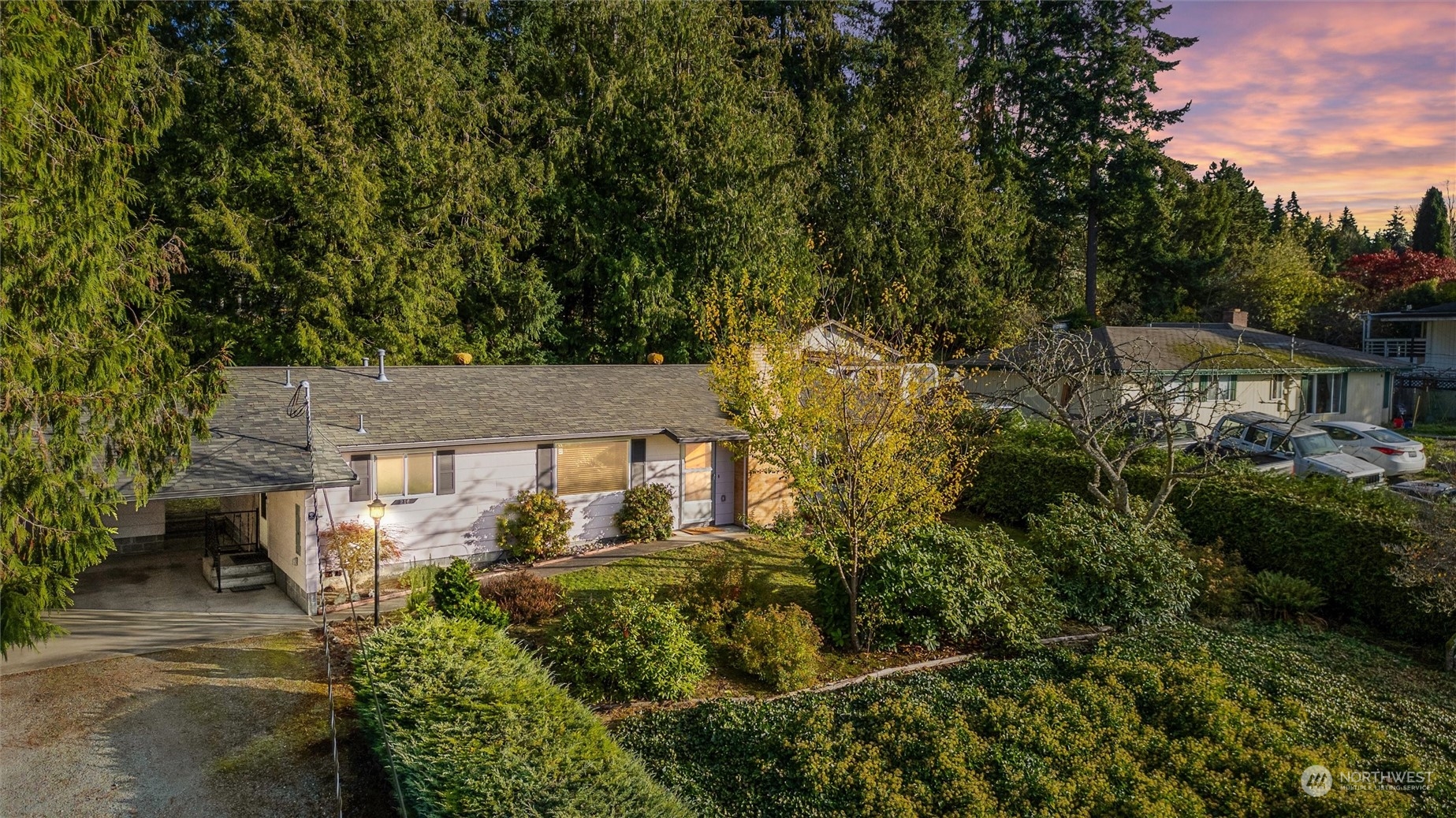 an aerial view of a house with a yard