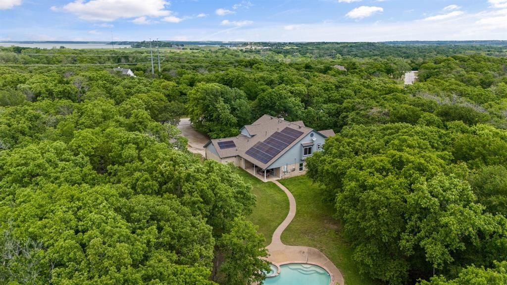 an aerial view of a house with a garden