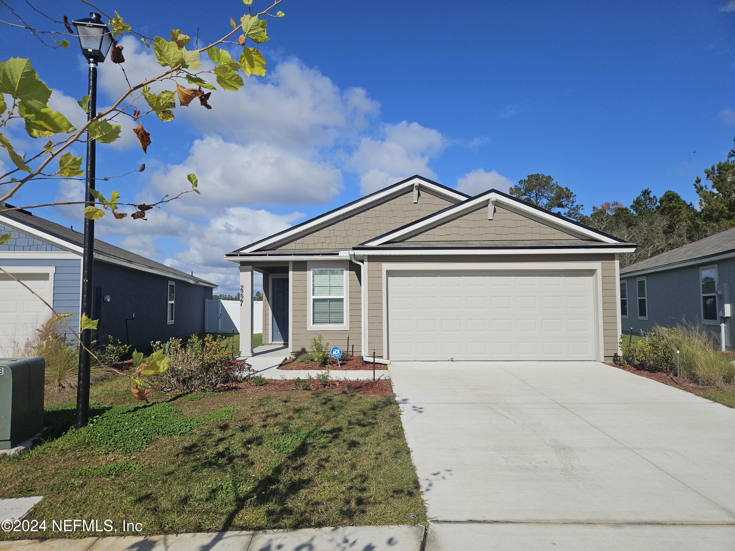 front view of a house with a yard