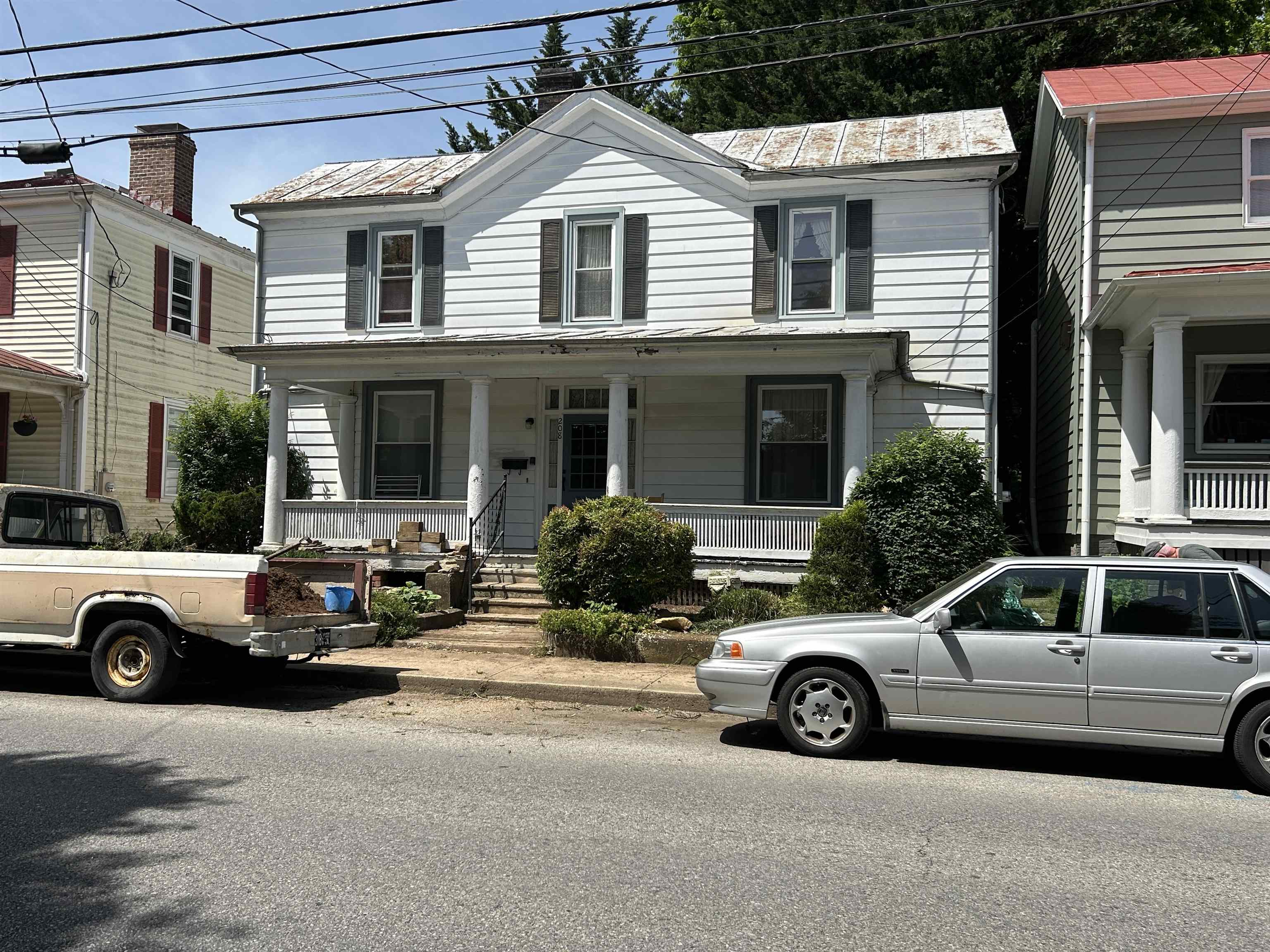 a view of a car parked in front of a house