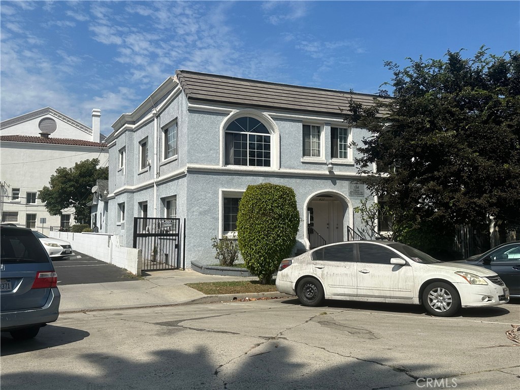 a front view of a house with parking space