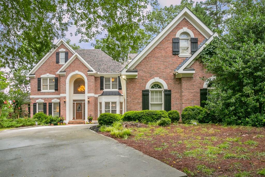 Enjoy country club living in St. Marlo Country Club! This four side brick home includes a circular drive on a private lot.