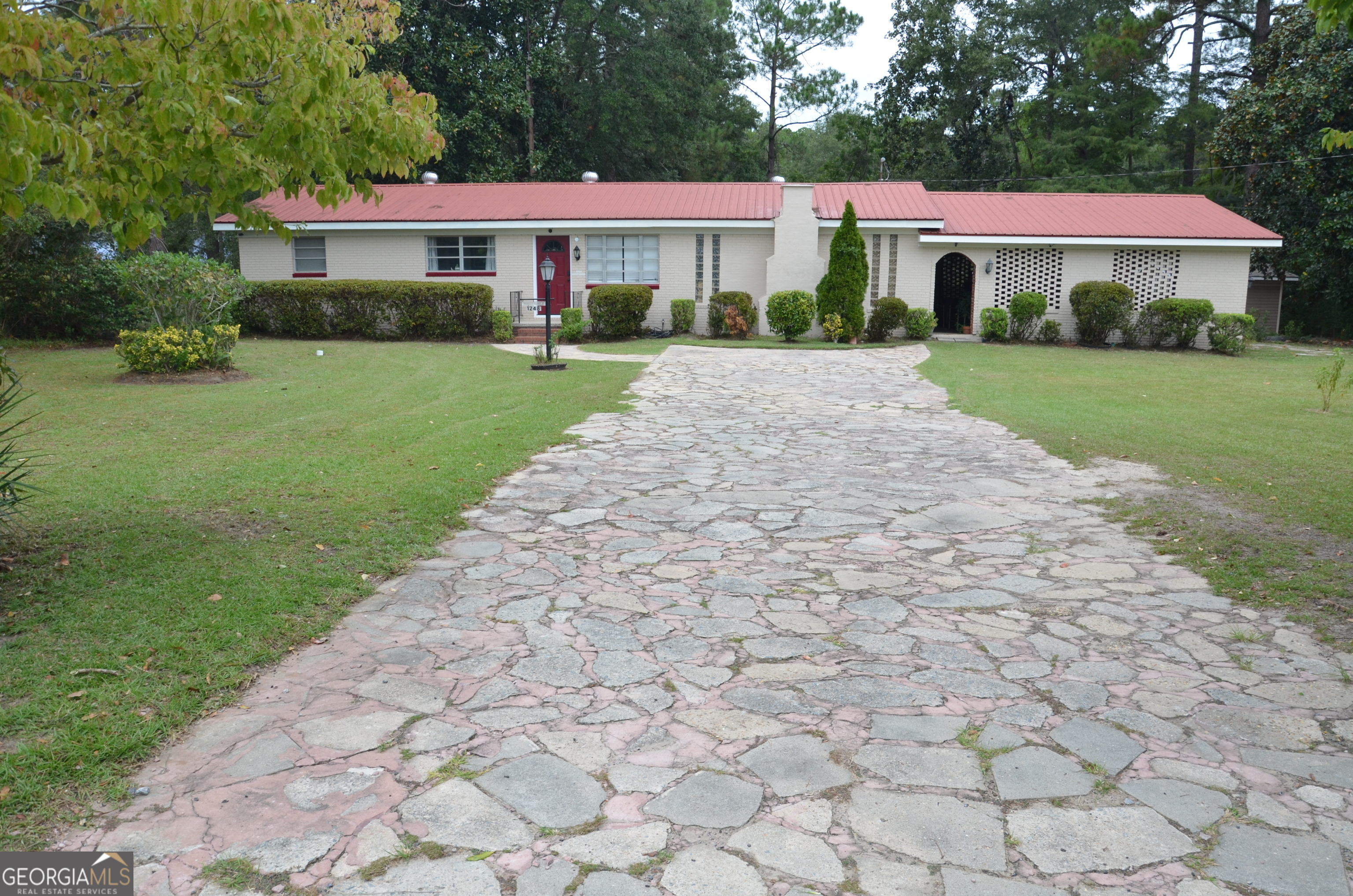 a front view of a house with yard