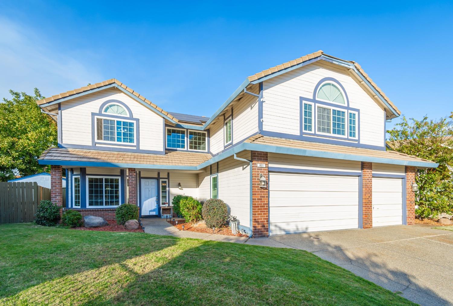 a front view of a house with a yard