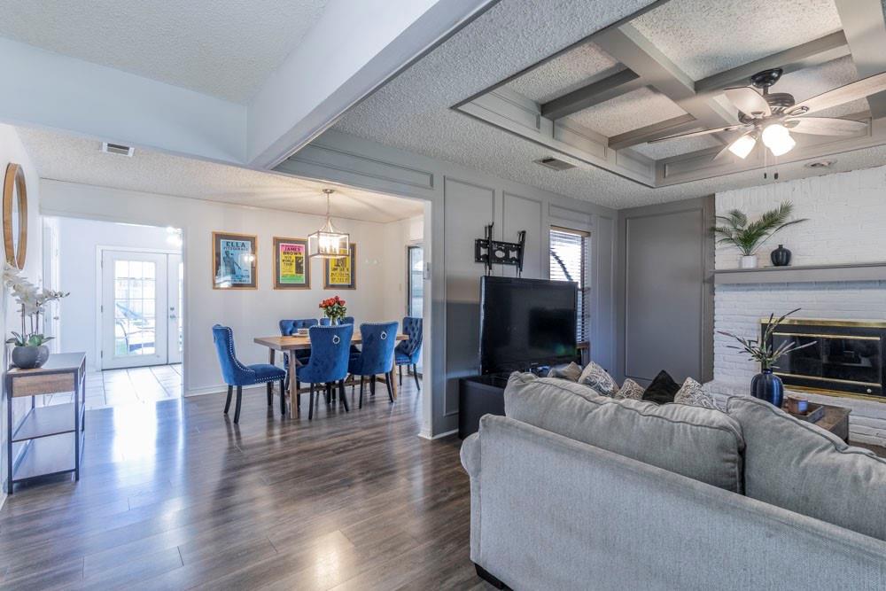 a living room with furniture and a fireplace