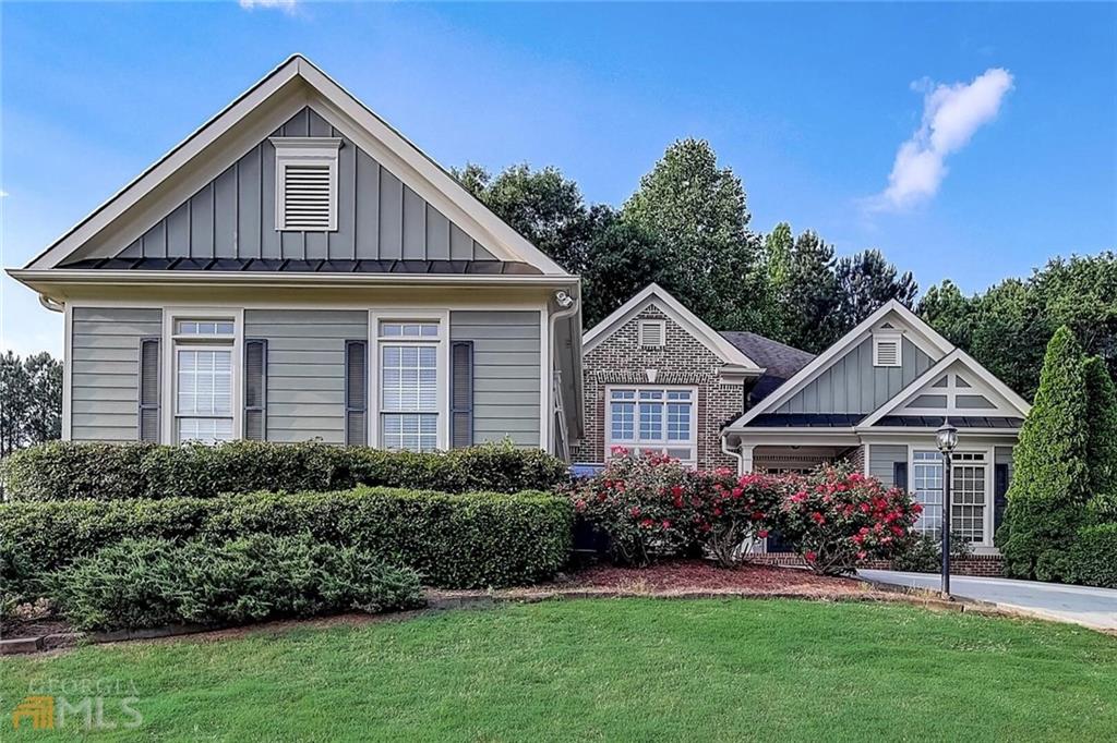 a front view of a house with a yard