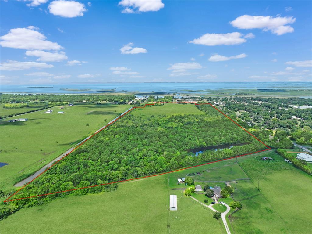 a view of a green field with clear sky