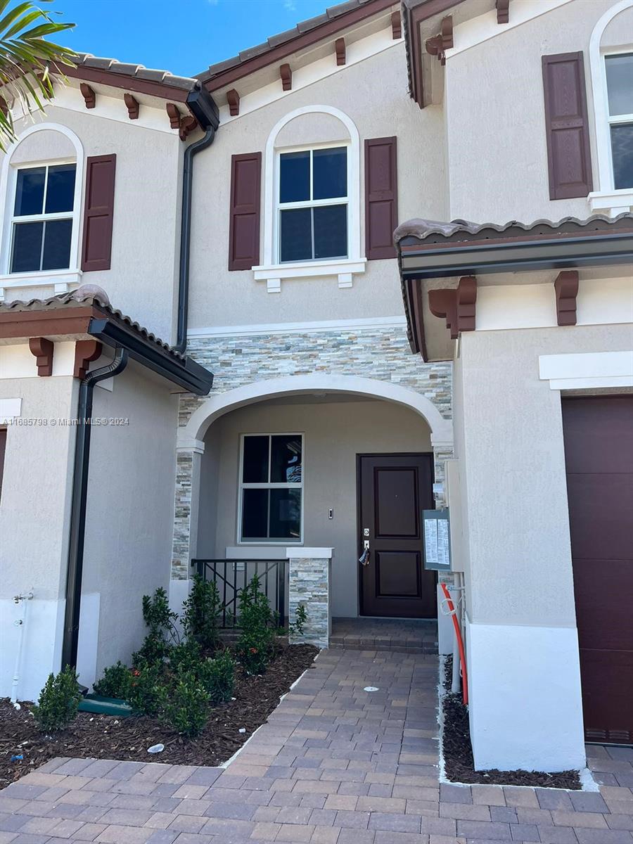 a front view of a house with a garage