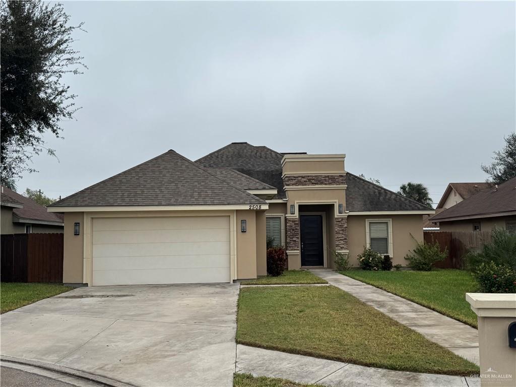 front view of a house with a yard