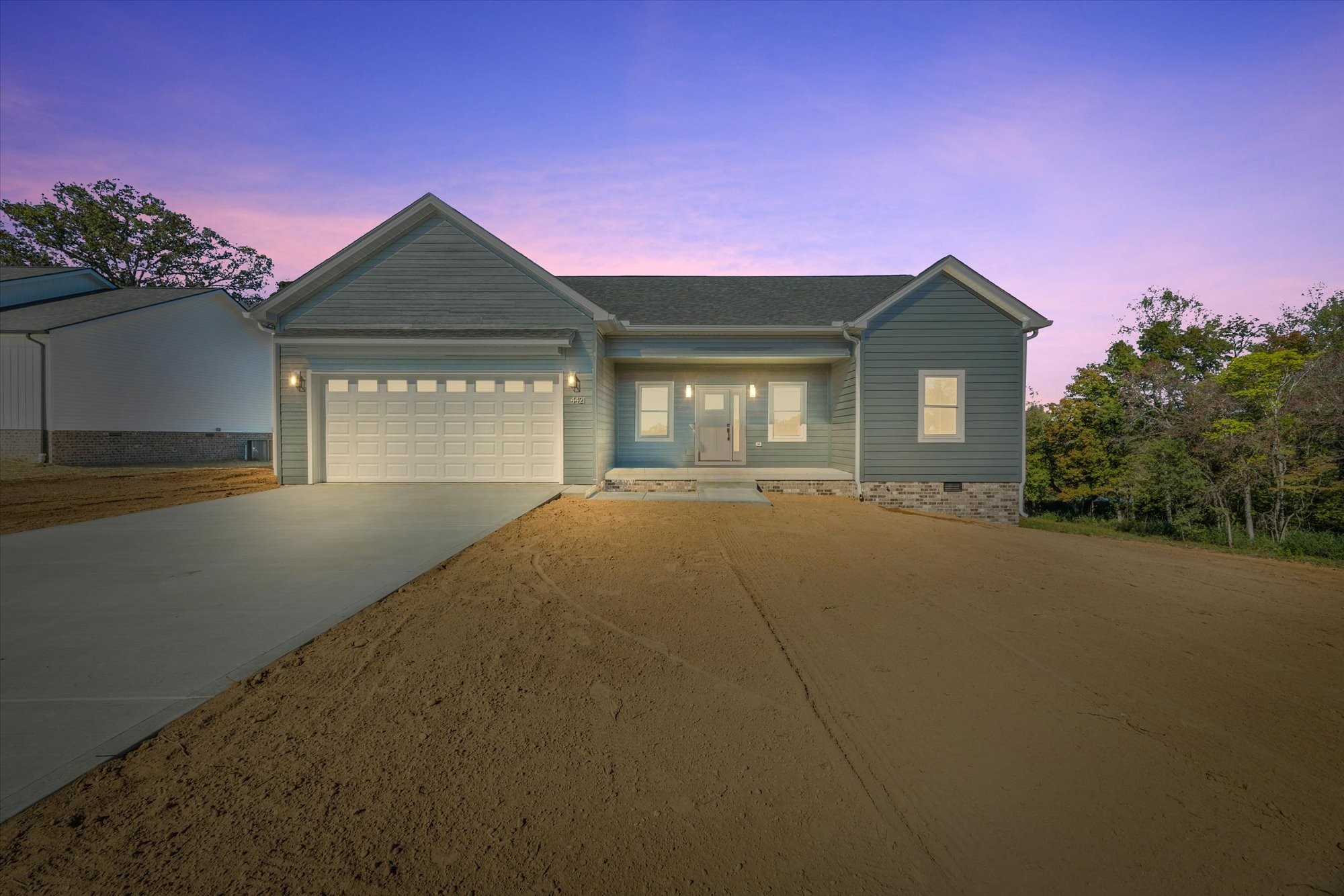 a front view of a house with yard