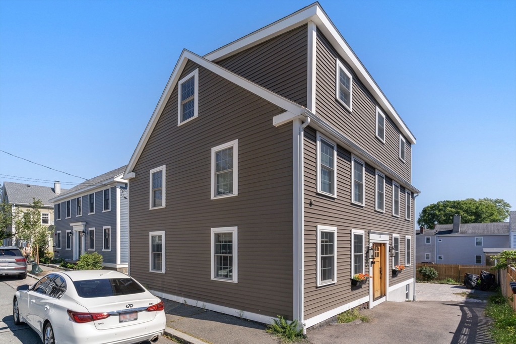 a front view of a house with parking