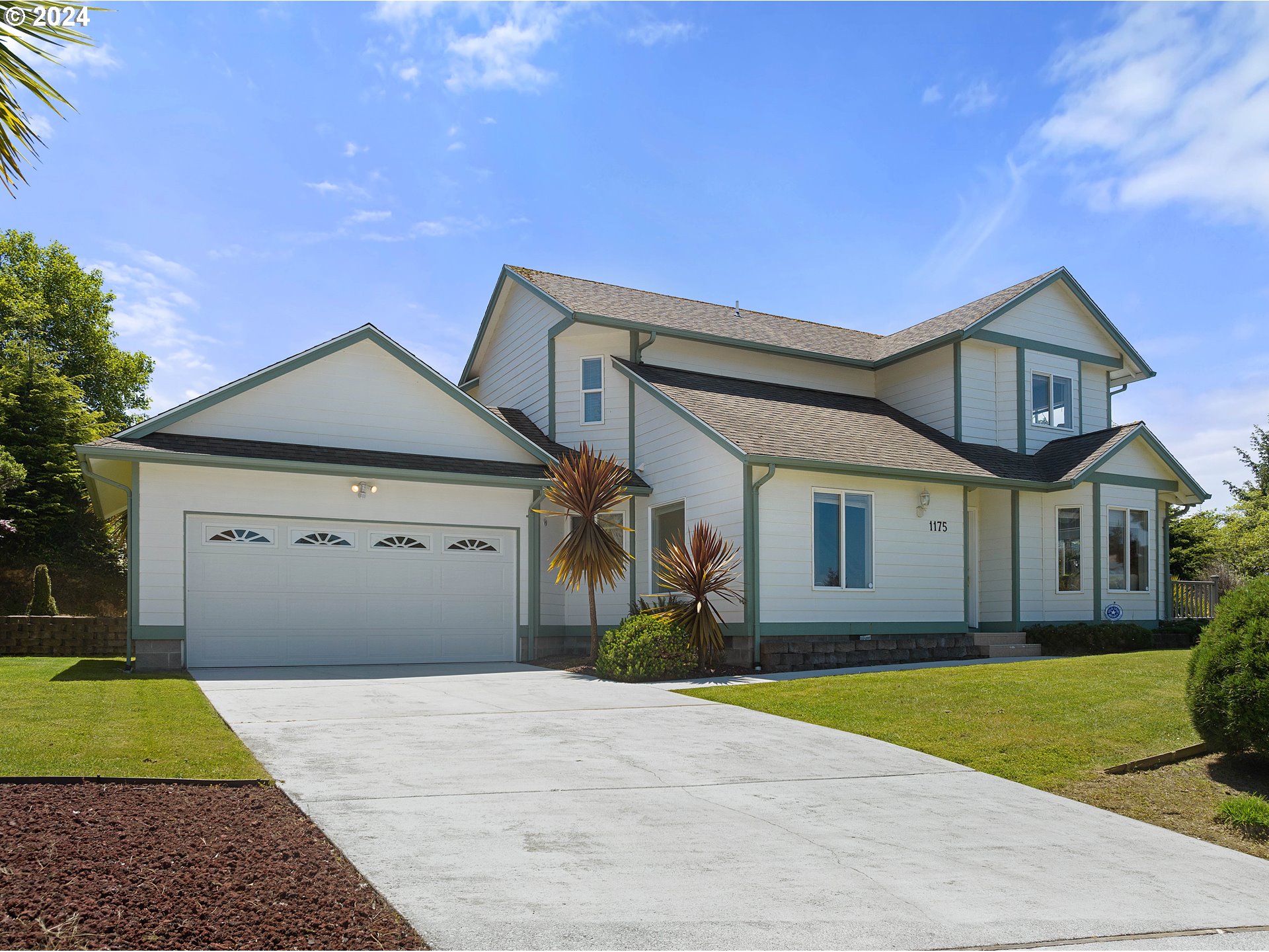 a front view of a house with yard