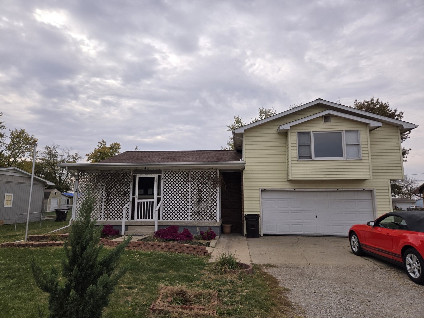 a front view of a house with parking space