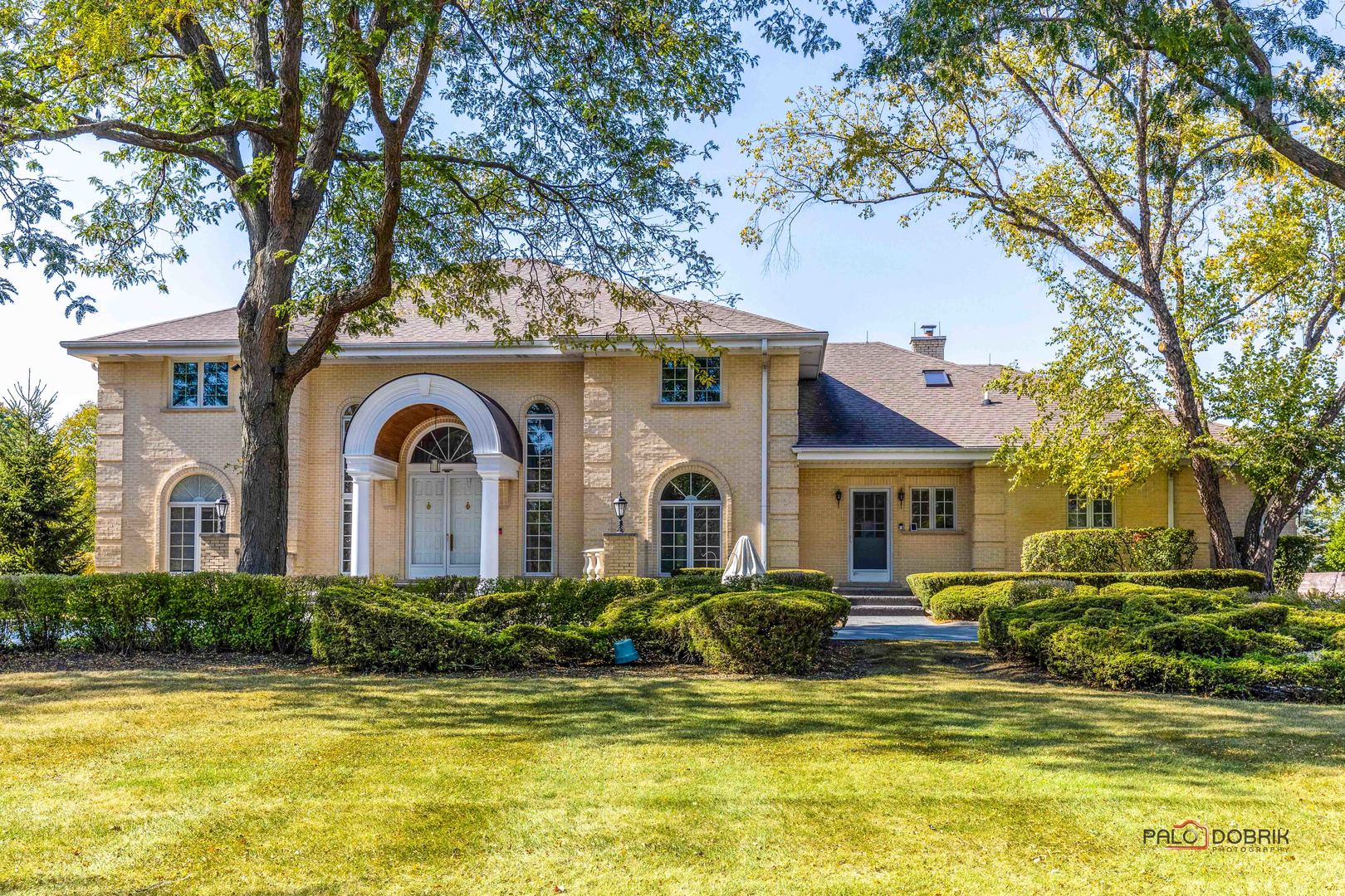 a front view of a house with swimming pool