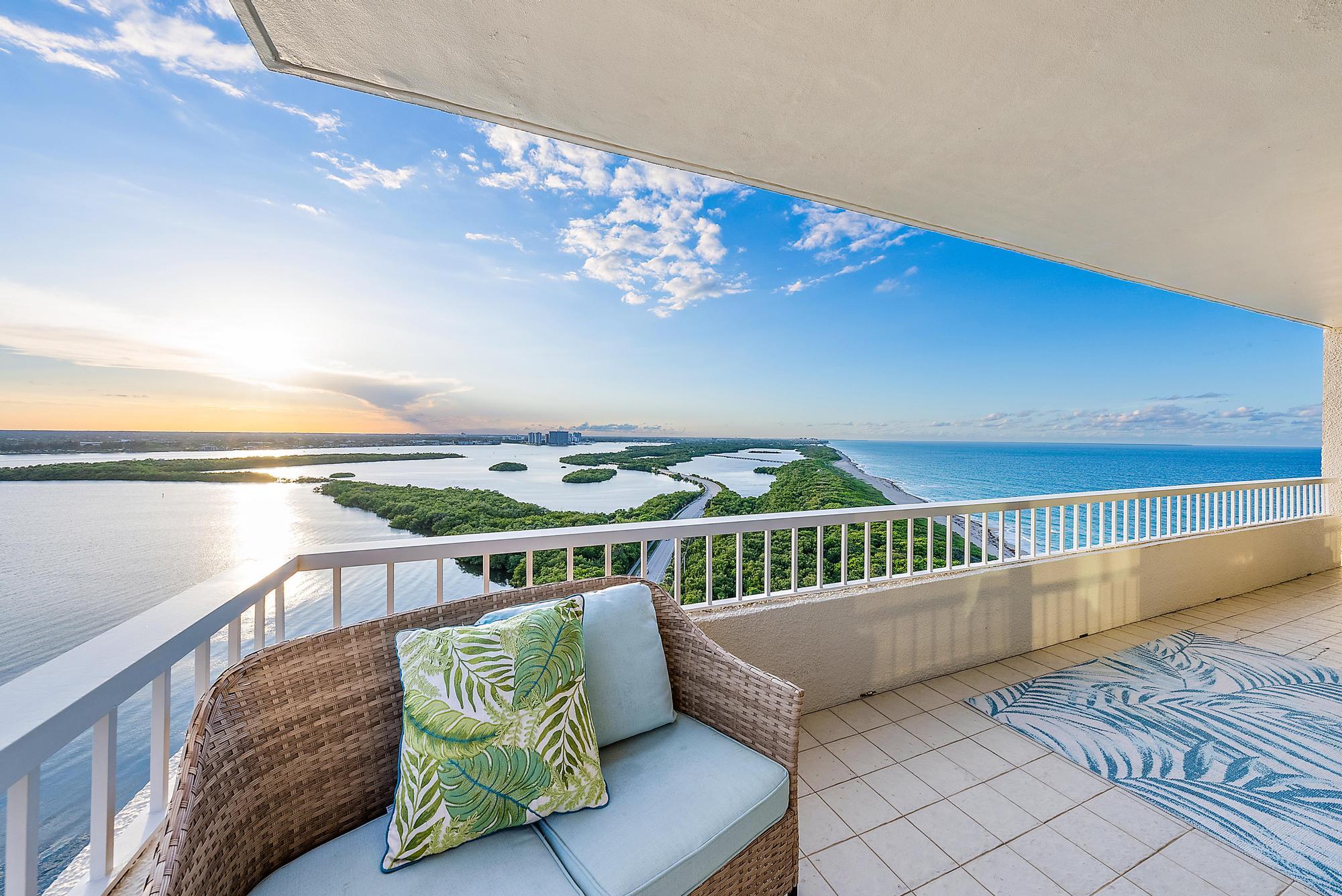 a view of a balcony with furniture