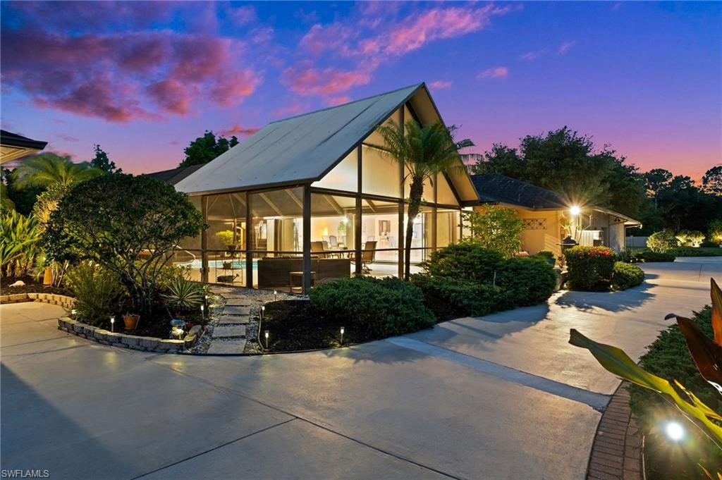 View of front of house with a swimming pool