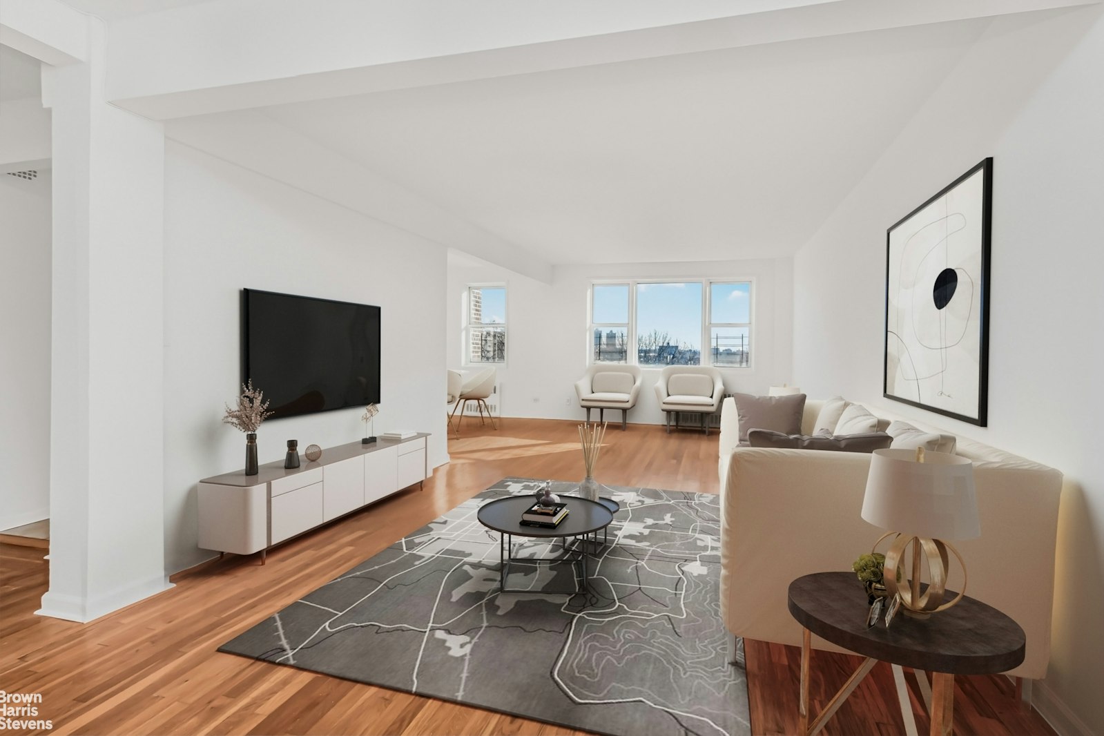 a living room with furniture and a flat screen tv