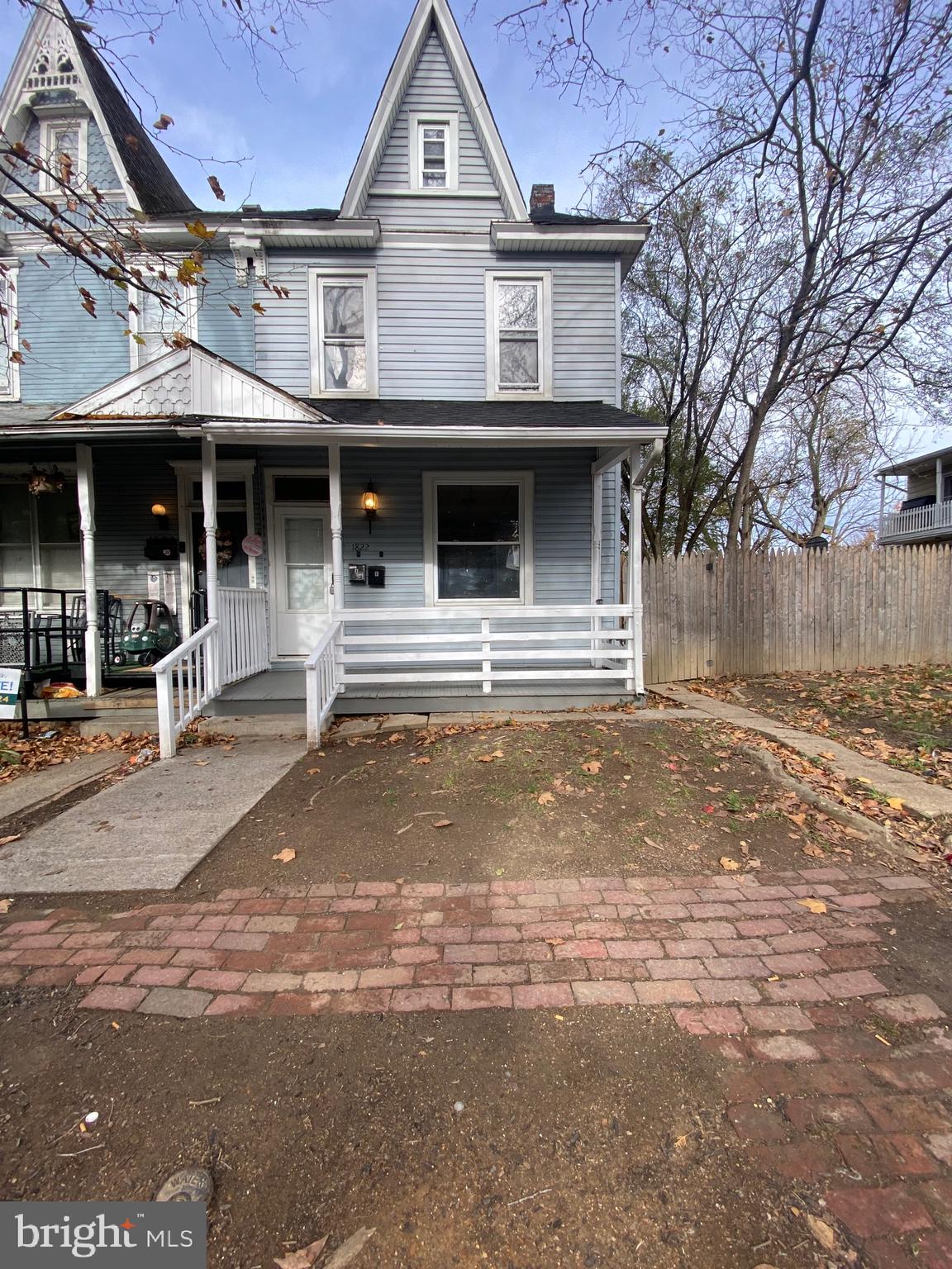 a front view of a house with a outdoor space