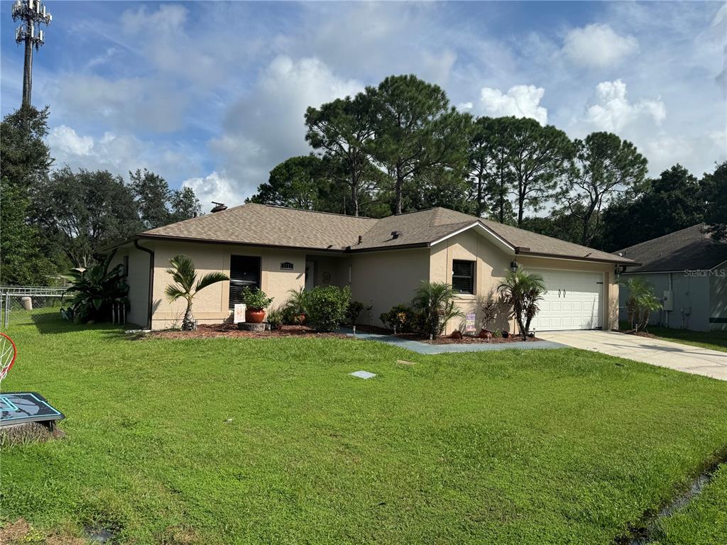 a front view of a house with garden