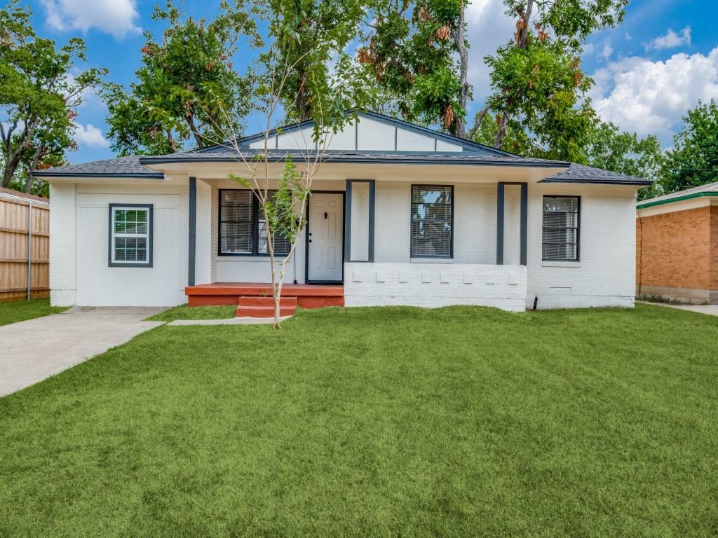 front view of a house with a yard