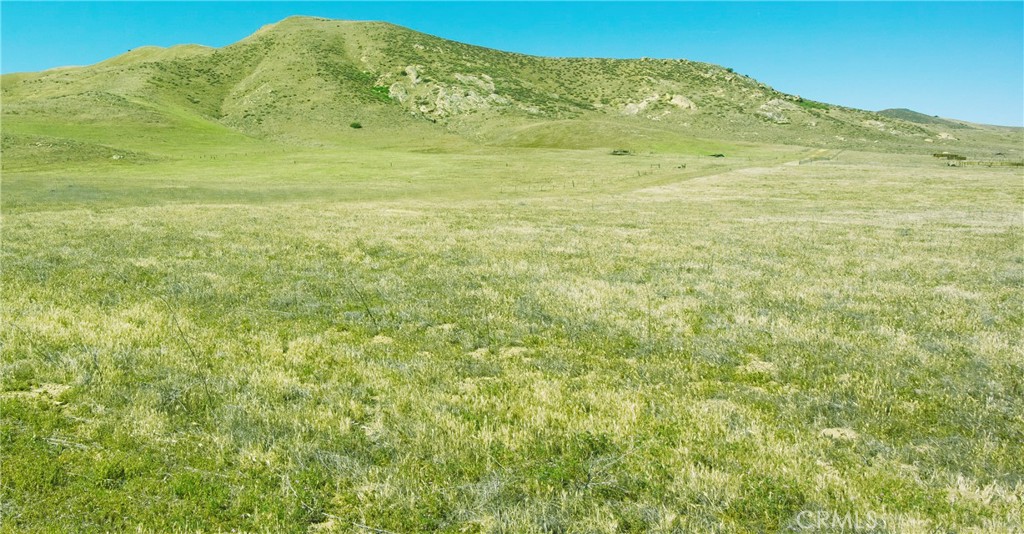 a view of a mountain view with mountains in the background