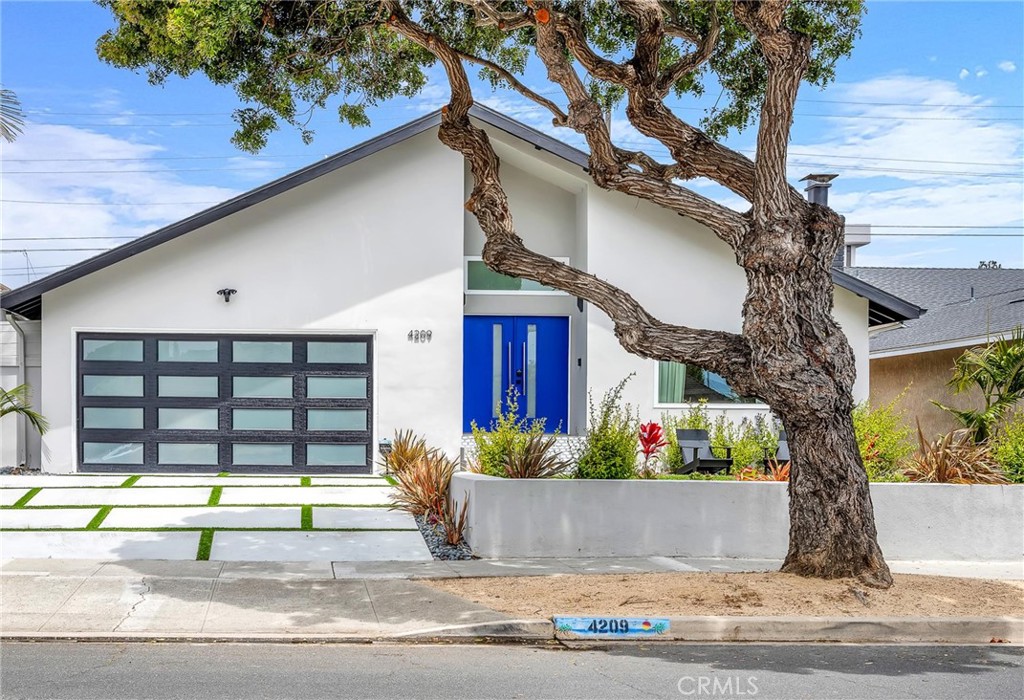 a view of a house and a yard