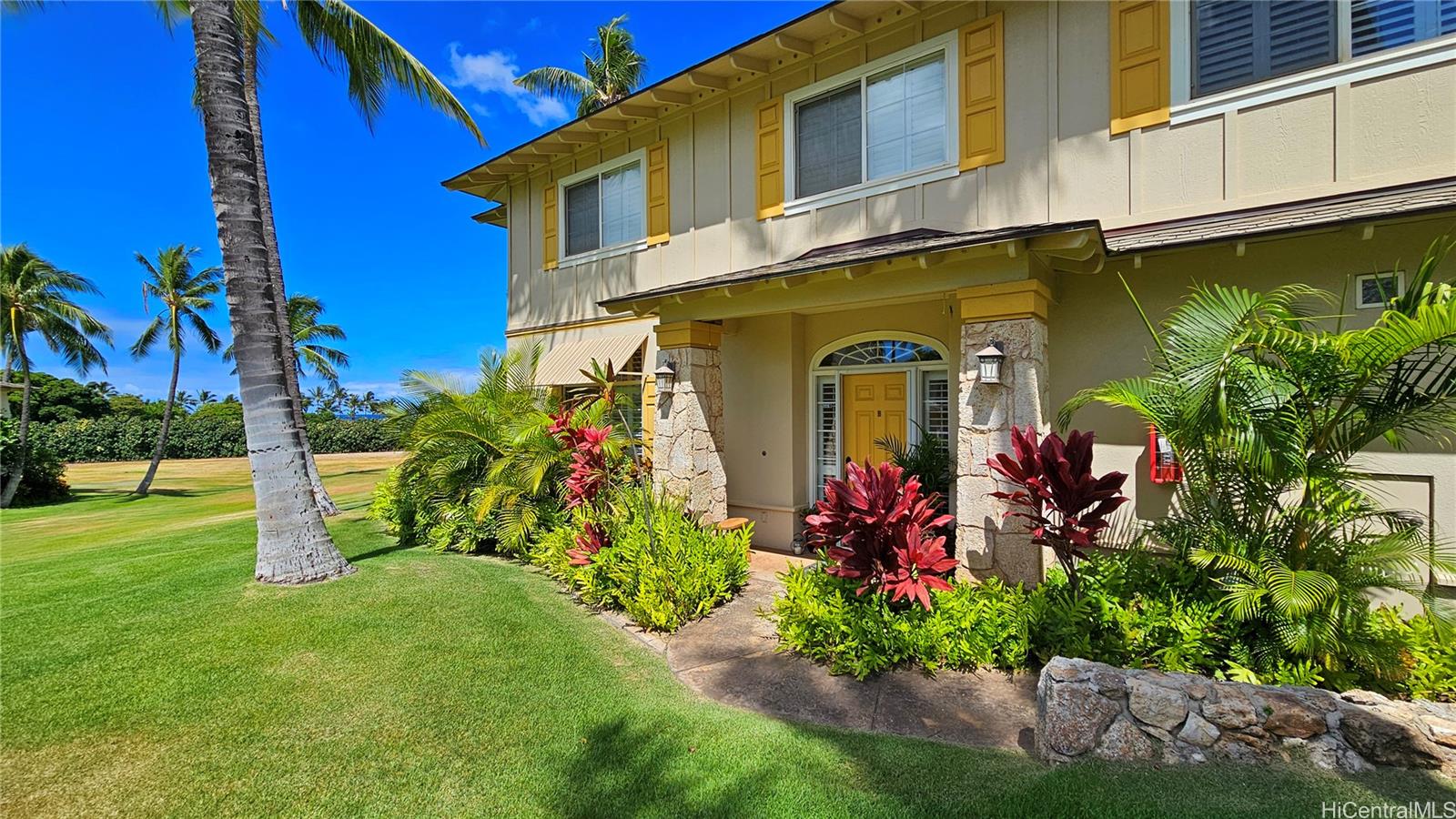 a front view of a house with a yard